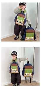 Detail of children's color-block canvas backpack with large capacity and side mesh pockets