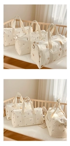 Quilted cotton mummy bag set in three sizes featuring floral and bear embroidery