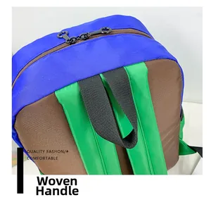 Close-up of color-block nylon schoolbag with woven handle and durable metal zippers