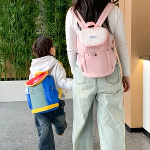 Parent-child matching backpacks in pink-white and vibrant multi-color blocks