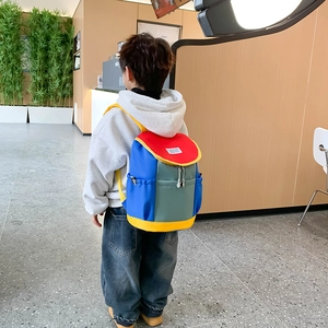Kids colorful patchwork backpack with blue and red panels for school and travel