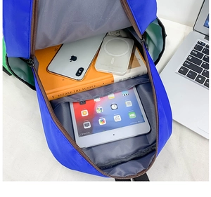Detailed interior view of blue school backpack with dedicated laptop compartment and large space