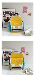 Flat lay of colorful canvas school backpack with yellow and blue color blocking