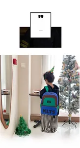 Detailed back view of a color-block children's backpack on a young boy in an indoor setting