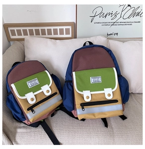 Detail of color-block canvas backpacks in two sizes with safety reflective strips