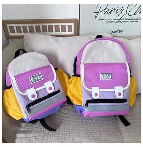 Detailed comparison of two sizes of cute contrast color canvas kids backpacks with safety reflective strips