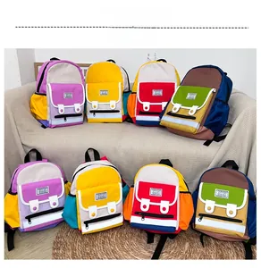 Detail of colorful kids backpacks with reflective safety strips and multiple pockets