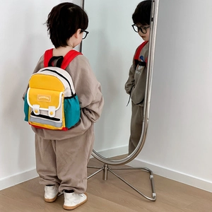Vibrant color-block canvas backpack for kindergarten kids featuring red, yellow and blue panels