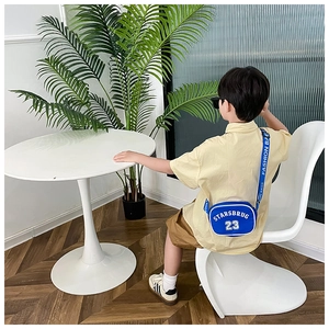 Detailed view of the blue nylon kids crossbody bag with white piping and letter print