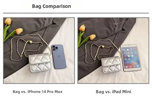 Size comparison of silver quilted crossbody bag with iPhone and iPad mini on soft bed