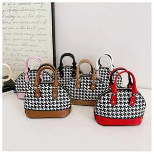 Detailed macro view of mini shell-shaped bags in classic houndstooth patterns with five colors
