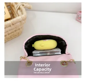 Internal capacity of pink quilted mini crossbody bag showing storage for small items