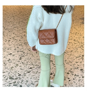 Brown quilted crossbody chain bag for girls shown on a child model with a stylish outfit