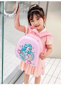 Pink mermaid backpack for kids featuring sequin details and ocean patterns on a shell shape