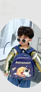 Detail of ergonomic padded straps on kids astronaut eggshell backpack for comfort