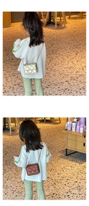 Detailed view of kids stylish quilted crossbody bag with gold metal chain straps