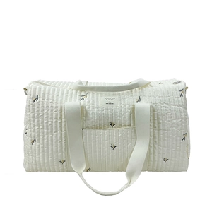 Off-white quilted diaper bag with leaf embroidery and large capacity for travel