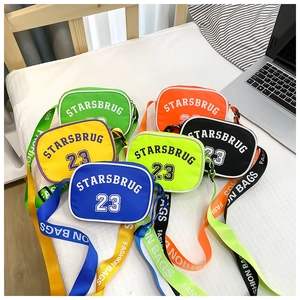 Macro shot showing multi-colored nylon crossbody bags with sporty letter prints