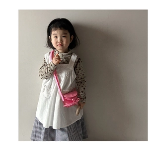 Pink mini crossbody bag for girls styled with white lace apron and floral vintage dress