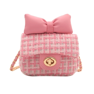 Pink tweed crossbody bag for girls with a large leather bow and gold chain strap