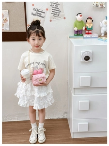 Pink quilted girls crossbody bag featuring a sweet bow and elegant gold chain strap