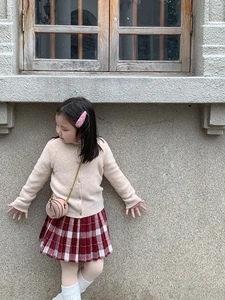 Pink mini round crossbody bag with bronze chain paired with kids preppy style outfit