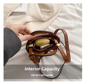 Internal capacity of the mini bear PU bag showing space for headphones and power bank