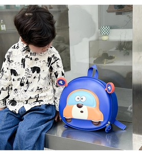 Close-up of lightweight kids blue backpack featuring a 3D orange car hardshell design