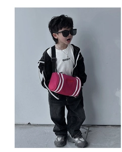 Detailed view of kids stylish rose red bucket crossbody bag with white stripes decoration