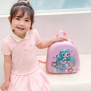 Pink cartoon mermaid eggshell backpack for girls shown on model with sea element decor