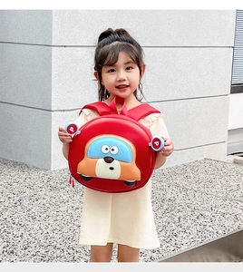 Detail of red cartoon car backpack showing adjustable straps and waterproof material