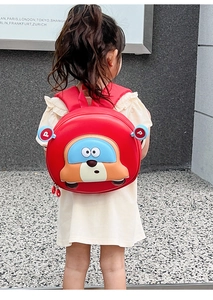 Close-up of red hardshell car backpack for kids with cute cartoon bear character