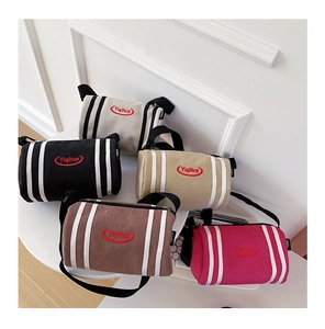 Detailed display of cylinder kids' crossbody bags in five colors with striped patterns