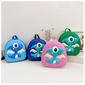 Detail of four colorful EVA hardshell children's backpacks featuring cartoon dinosaur designs