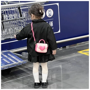 Detailed view of pink sweet heart handbag with adjustable strap for little girls