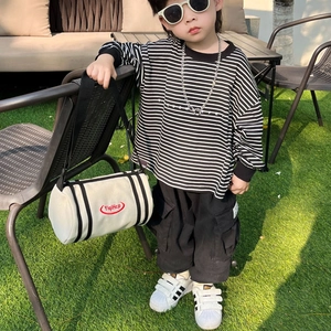 Kids cool striped long sleeve shirt with black cargo pants and white cylinder crossbody bag