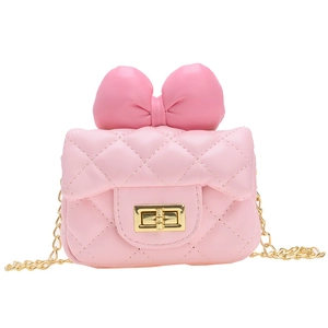 Pink quilted mini crossbody bag for girls with decorative bow and golden chain strap