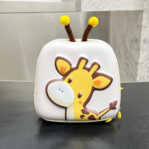 Detail of 3D cartoon giraffe eggshell backpack with cute plush horns and yellow zipper