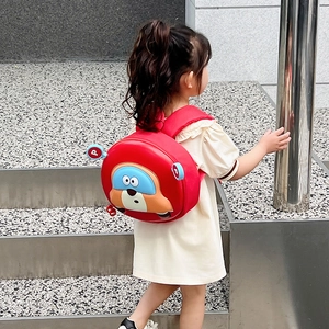Red 3D cartoon car backpack for toddlers featuring a cute robot face and durable shell