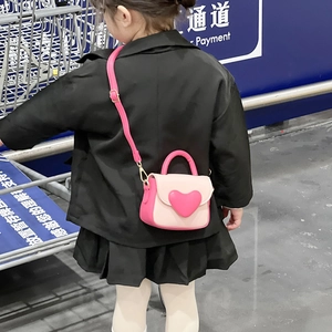 Sweet heart-shaped pink children's crossbody bag with top handle for toddlers