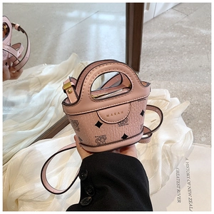 Close-up of pink PU leather mini bag with bear pattern and metal MARAH logo detail