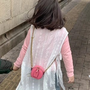 Pink round mini chain bag for kids paired with lace vest and floral embroidery