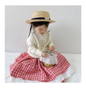 Girl's summer straw hat, knit cardigan, and red plaid dress with lace trim basket bag