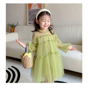Detail of light green girls layered tulle dress with glitter and ruffle collar