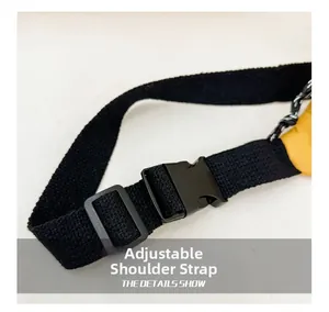 Detail of adjustable nylon shoulder strap with a black plastic buckle on kids waist bag