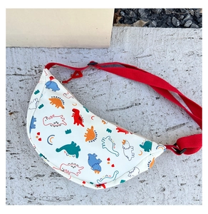 Close-up of kids dinosaur crossbody bag with colorful cartoon prints and adjustable strap
