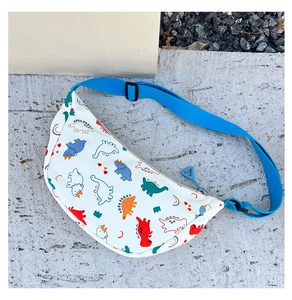 Detail of adjustable royal blue strap and cartoon dinosaur print on kids canvas bag