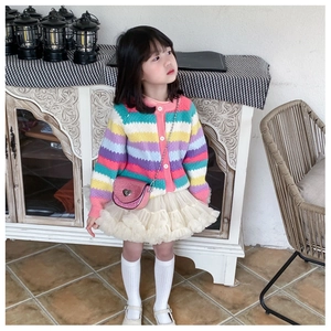 Pink sequin crossbody bag with heart lock styled on a toddler girl in rainbow cardigan