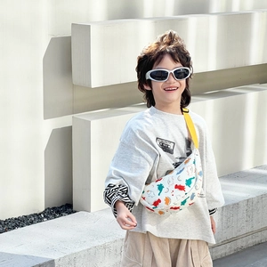 Cute white cartoon dinosaur chest bag for boys with adjustable yellow shoulder strap
