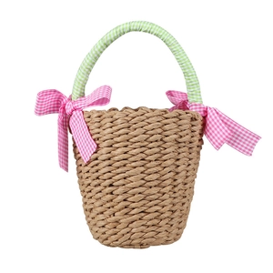 Handmade woven straw beach handbag for girls featuring pink bows and green checkered handle